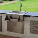 A beautifully finished outdoor sink and outdoor kitchen